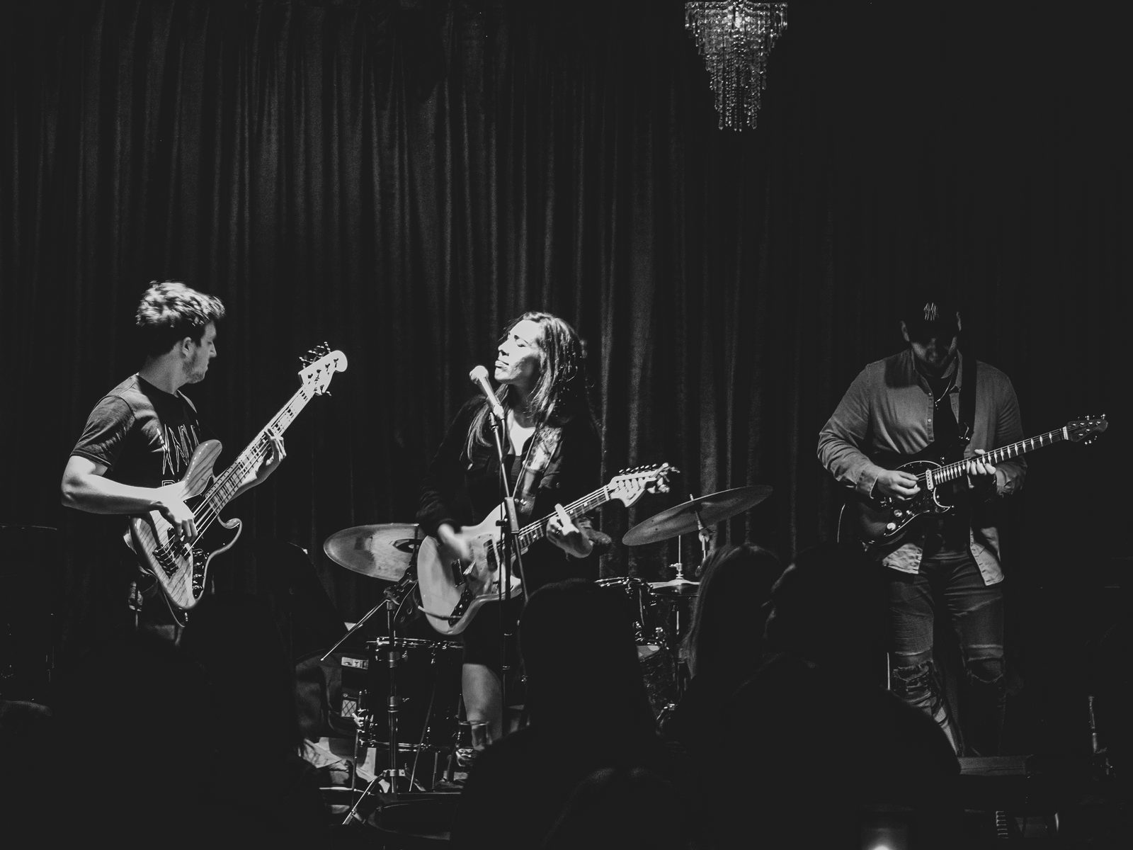 Jess Fairlie playing guitar with her band
